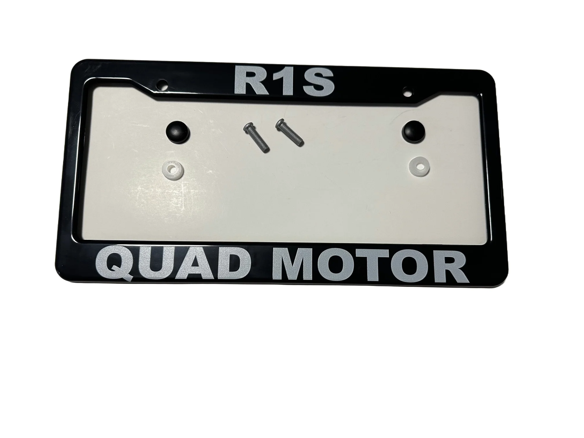 Black ABS License Plate Frame with lettering "R1S Quad Motor" for Rivian R1S